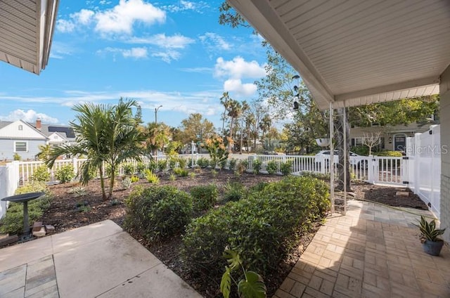 view of patio featuring fence