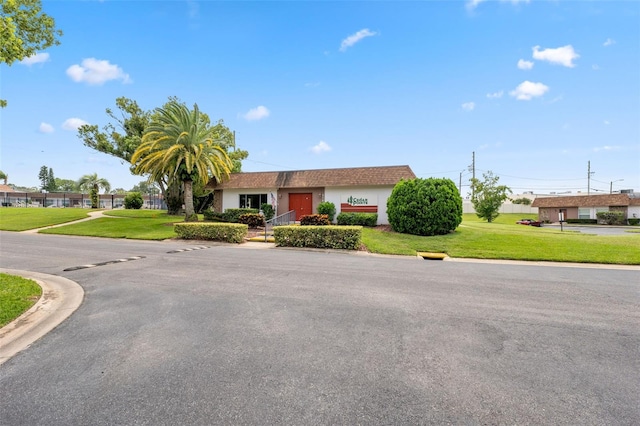 view of front of property featuring a front yard and stucco siding