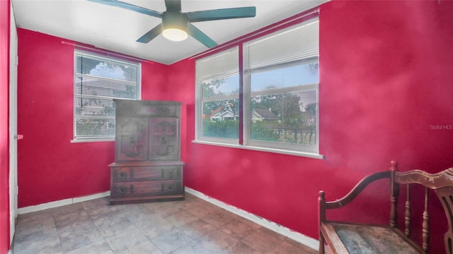 bedroom with baseboards and ceiling fan