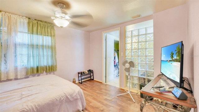 bedroom featuring a ceiling fan and wood finished floors