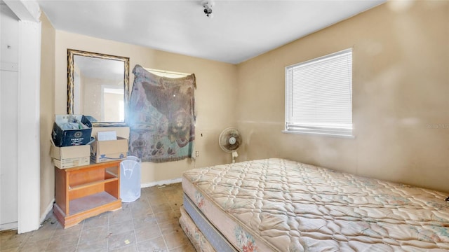 bedroom featuring baseboards
