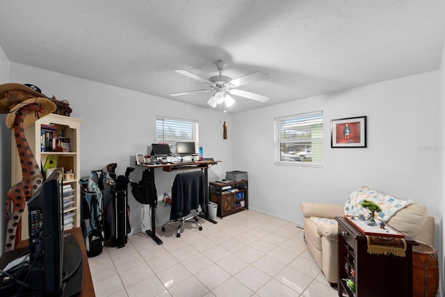 office area with light tile patterned floors, a textured ceiling, a wealth of natural light, and a ceiling fan