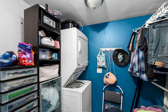 interior space featuring stacked washer / dryer