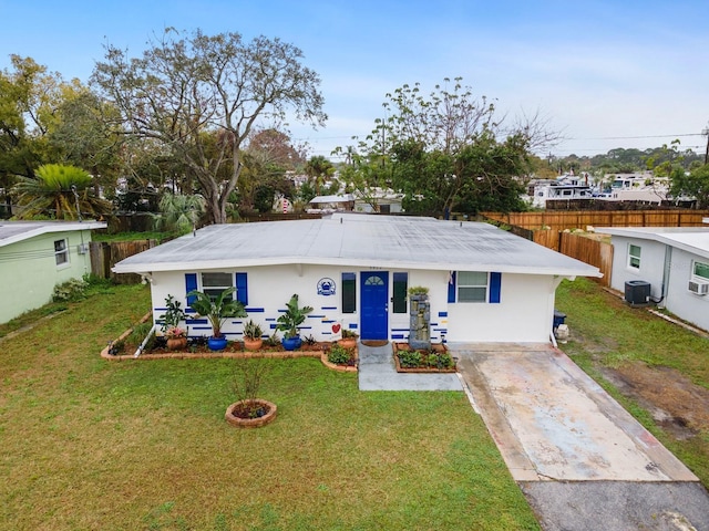 single story home featuring a front yard, concrete driveway, fence, and central air condition unit