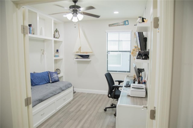 office featuring light wood-style flooring, baseboards, a ceiling fan, and recessed lighting