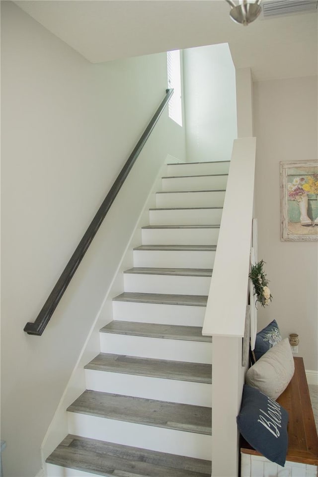 stairway featuring baseboards