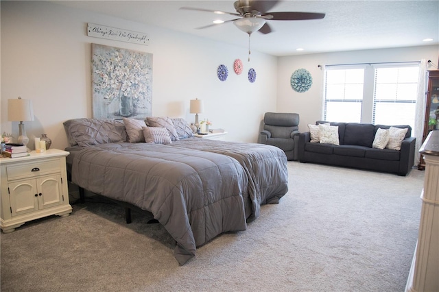 bedroom with light carpet, a ceiling fan, and recessed lighting