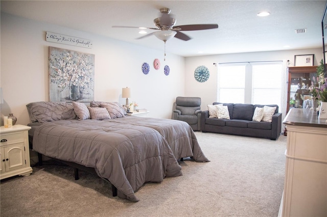 bedroom with recessed lighting, visible vents, a ceiling fan, and light colored carpet