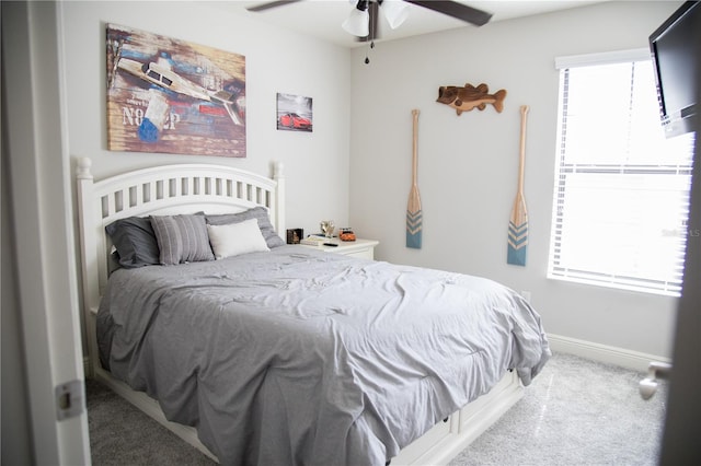 bedroom with carpet flooring, ceiling fan, and baseboards