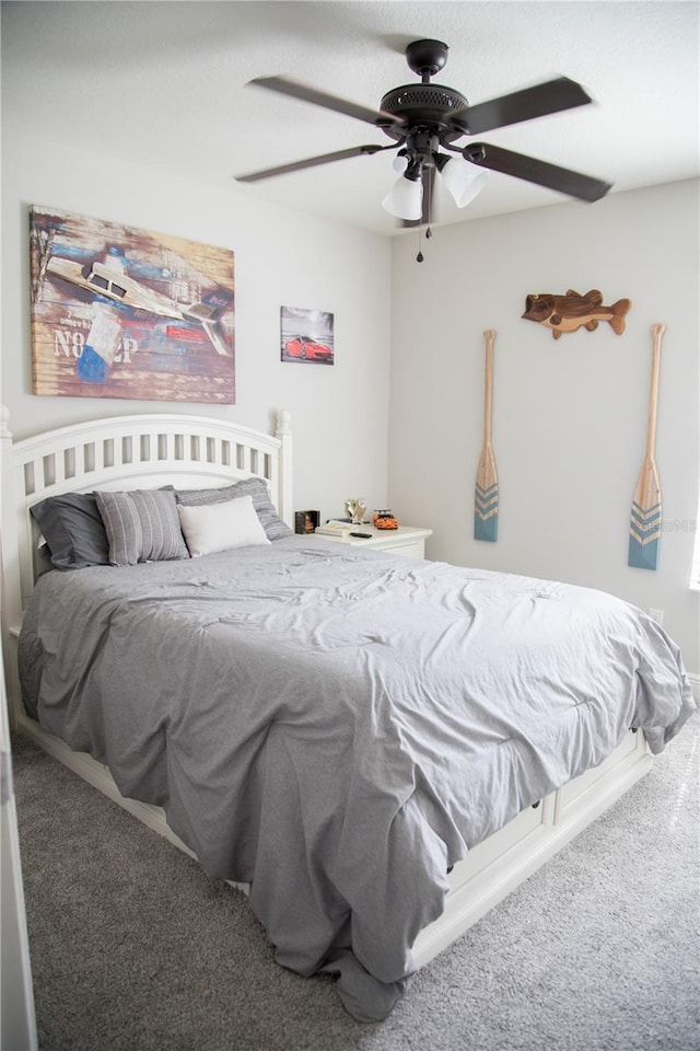 carpeted bedroom with a ceiling fan