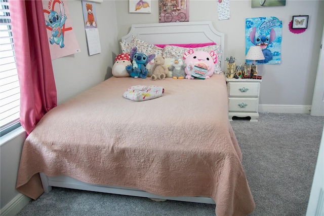 bedroom with carpet and baseboards