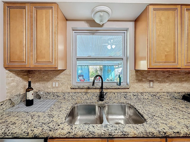 4100 Narvarez Way S, Saint Petersburg, FL 33712 - kitchen with a sink, decorative backsplash, and light stone countertops