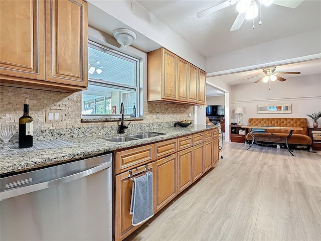 4100 Narvarez Way S, Saint Petersburg, FL 33712 - kitchen featuring dishwasher, ceiling fan, a sink, light wood finished floors, and stone counters