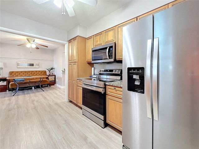 4100 Narvarez Way S, Saint Petersburg, FL 33712 - kitchen with stainless steel appliances, a ceiling fan, light wood finished floors, and open floor plan