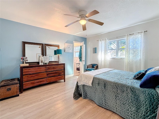 4100 Narvarez Way S, Saint Petersburg, FL 33712 - bedroom with light wood finished floors, ceiling fan, a textured ceiling, and baseboards