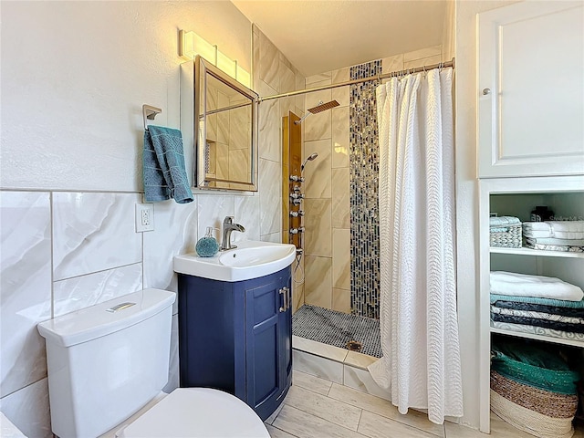 4100 Narvarez Way S, Saint Petersburg, FL 33712 - bathroom with toilet, vanity, a tile shower, and wood tiled floors
