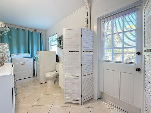 4100 Narvarez Way S, Saint Petersburg, FL 33712 - bathroom with tile patterned flooring, washer and clothes dryer, toilet, a closet, and ornamental molding
