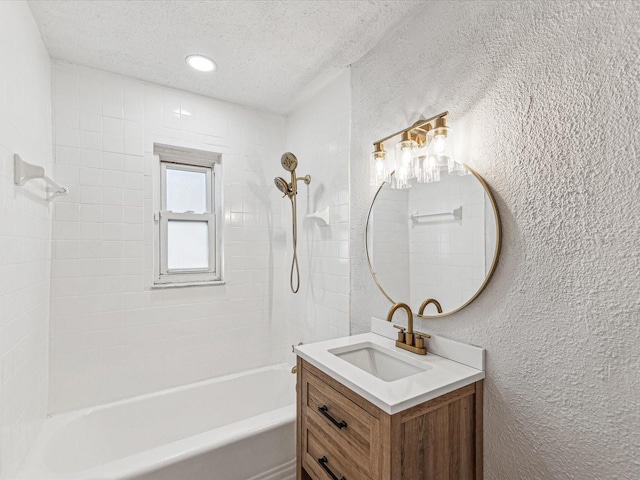 bathroom featuring a textured ceiling, a textured wall, recessed lighting, vanity, and  shower combination