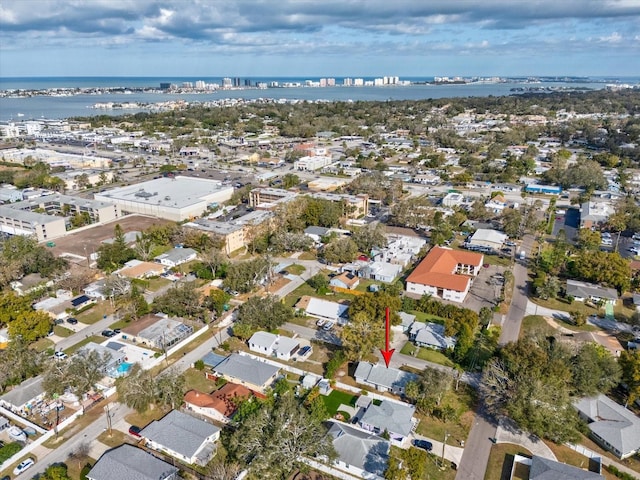 drone / aerial view with a water view and a residential view