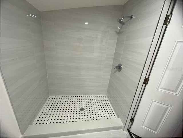 full bath featuring a shower stall