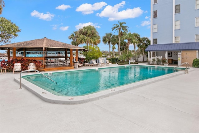 community pool featuring a patio and a gazebo