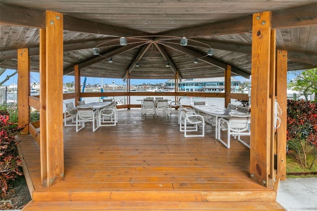 wooden terrace featuring outdoor dining area