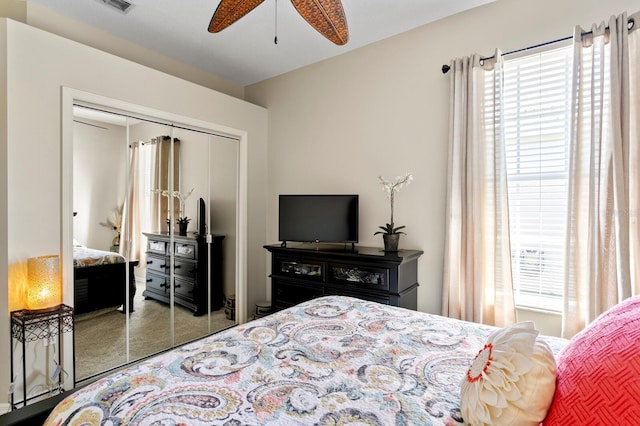 bedroom featuring a closet, visible vents, and ceiling fan