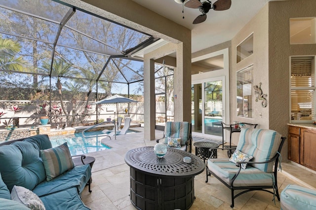 view of patio / terrace featuring glass enclosure, ceiling fan, outdoor lounge area, and a fenced in pool