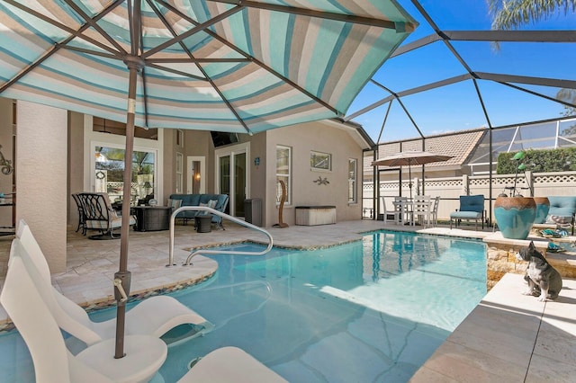 view of swimming pool with a fenced in pool, glass enclosure, a patio area, and an outdoor hangout area