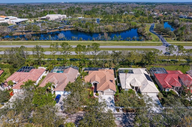 birds eye view of property featuring a water view and a residential view