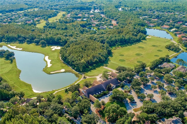 drone / aerial view with a water view and view of golf course