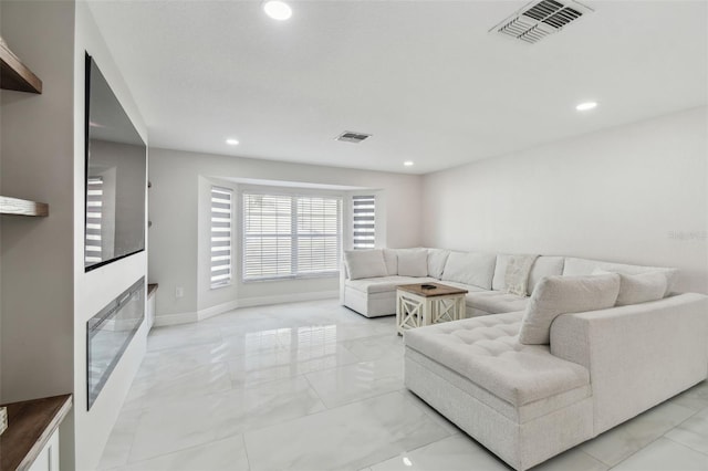 living room with recessed lighting, marble finish floor, visible vents, and baseboards