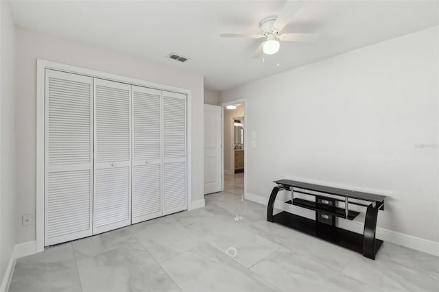 bedroom with a ceiling fan, a closet, visible vents, and baseboards