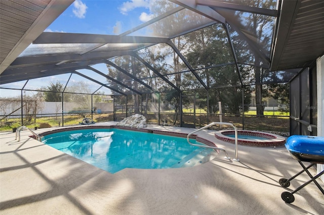 view of pool with a lanai, a patio area, a pool with connected hot tub, and grilling area