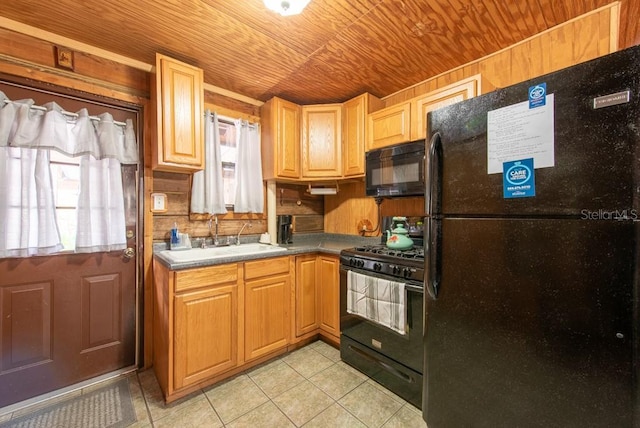 kitchen with wooden ceiling, a sink, black appliances, and light tile patterned floors