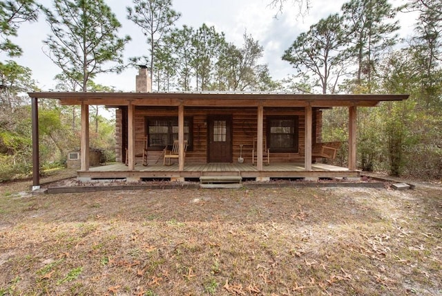 view of front of property with a chimney