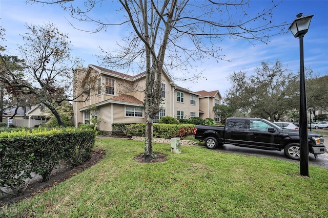 view of property exterior with a yard