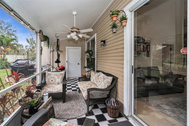 sunroom with lofted ceiling and a ceiling fan