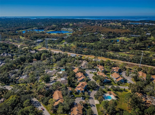 birds eye view of property featuring a water view and a residential view