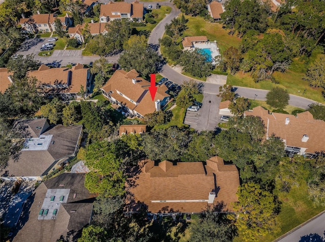 birds eye view of property with a residential view