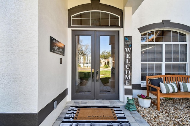 1301 Jen Ma Jo Ln, Lutz, FL 33549 - view of exterior entry featuring french doors and stucco siding