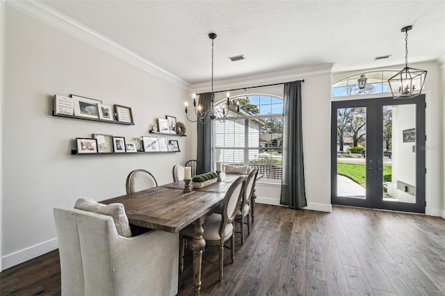 1301 Jen Ma Jo Ln, Lutz, FL 33549 - dining area featuring a chandelier, ornamental molding, dark wood-style flooring, and french doors