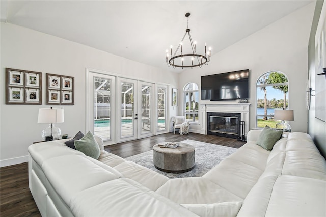 1301 Jen Ma Jo Ln, Lutz, FL 33549 - living area with french doors, a chandelier, plenty of natural light, dark wood-type flooring, and high vaulted ceiling
