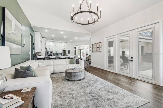 1301 Jen Ma Jo Ln, Lutz, FL 33549 - living area with vaulted ceiling, a chandelier, dark wood finished floors, and recessed lighting