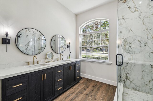 1301 Jen Ma Jo Ln, Lutz, FL 33549 - full bathroom with lofted ceiling, double vanity, wood finished floors, and a marble finish shower
