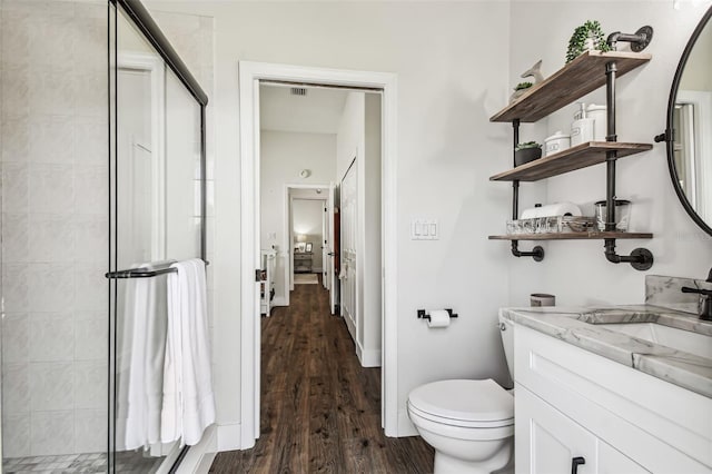 1301 Jen Ma Jo Ln, Lutz, FL 33549 - bathroom with a shower stall, wood finished floors, and vanity