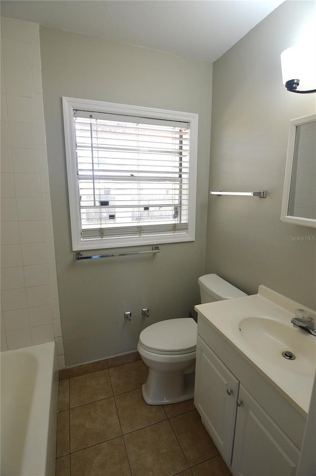 full bath with tile patterned flooring, baseboards, vanity, and toilet