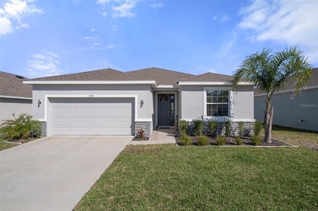 ranch-style house with an attached garage, stone siding, a front lawn, and stucco siding