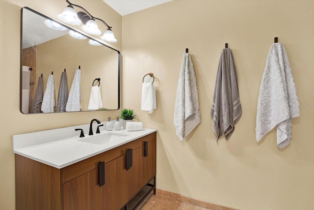 bathroom featuring tile patterned flooring and vanity