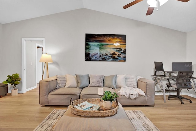 living room with light wood-style flooring, baseboards, vaulted ceiling, and a ceiling fan